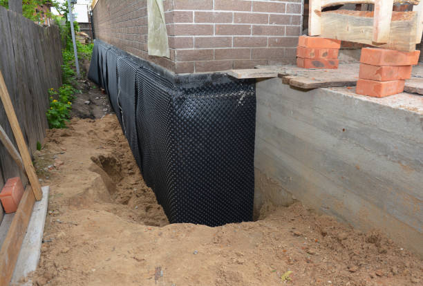 SJ Waterproofing Pros technician performing targeted Emergency Waterproofing assessment in Abingdon, VA